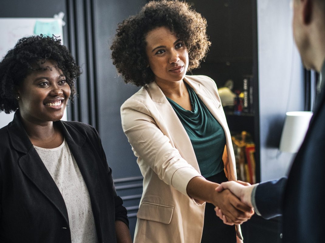 Business partners shaking hands in agreement Business partners shaking hands in agreement